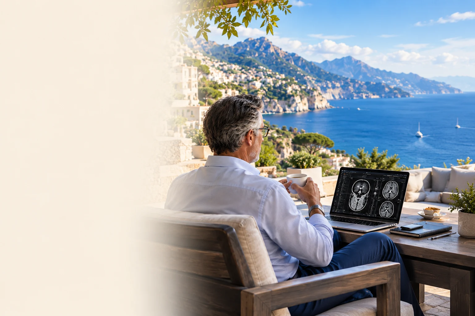 Radiologist at a workstation overlooking a blue coastal landscape.